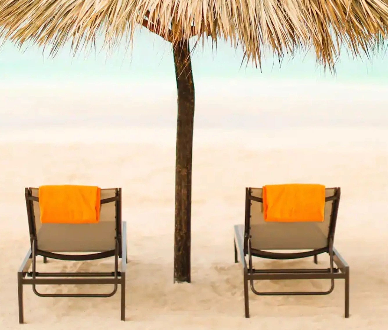 Beach chairs set out beside the Caribbean Sea in Jamaica