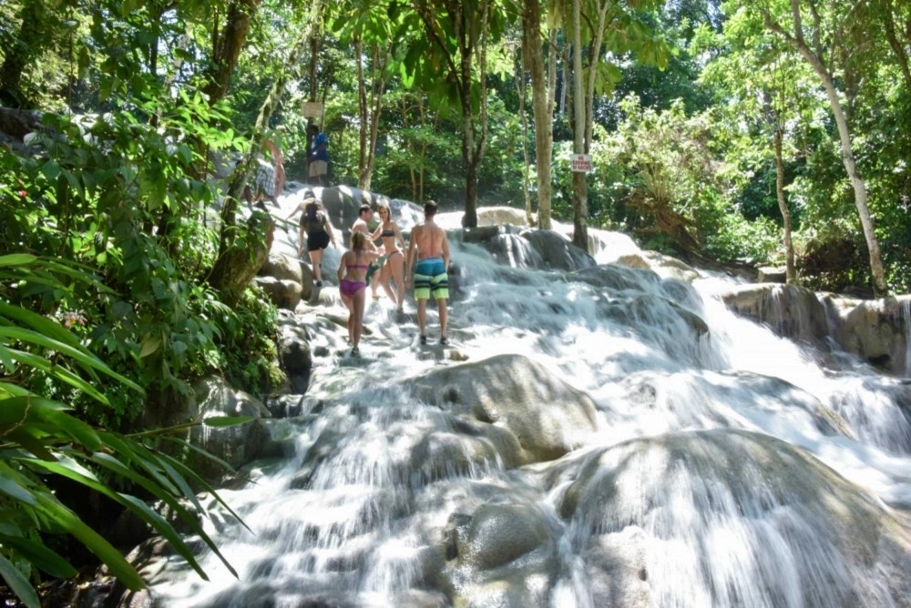 Visitors climbing the waterfalls at Dunn’s River Falls
