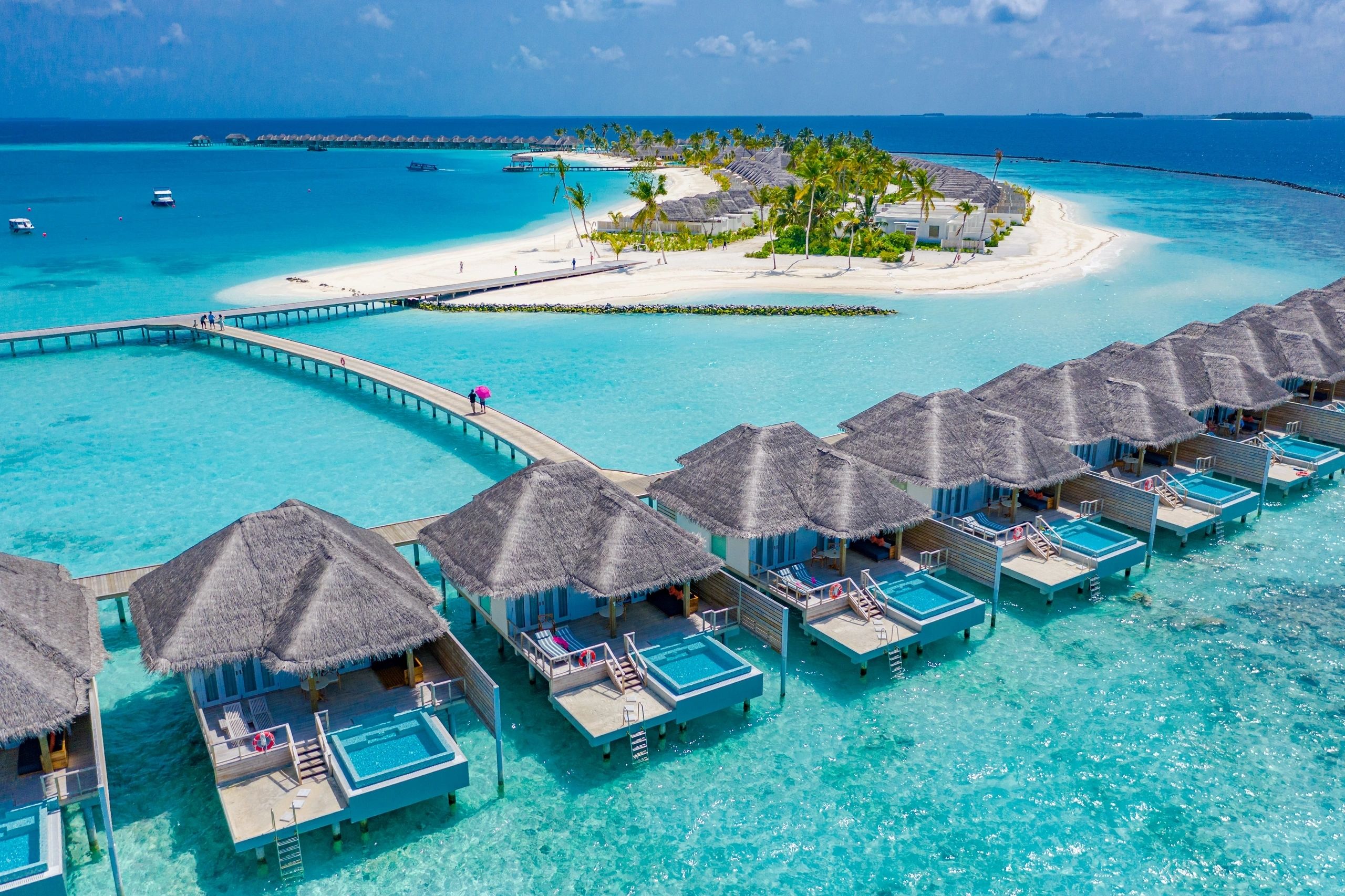 Aerial view over the Maldives' turquoise lagoons and islands